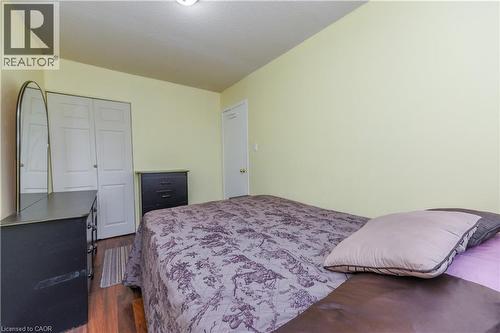 Bedroom featuring dark wood-style flooring and a closet - 85 Enmount Drive, Brampton, ON - Indoor Photo Showing Bedroom