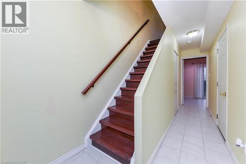 Stairs featuring tile patterned flooring and a textured ceiling - 85 Enmount Drive, Brampton, ON - Indoor Photo Showing Other Room