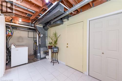 Unfinished basement with washer / dryer and heating unit - 85 Enmount Drive, Brampton, ON - Indoor