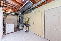 Unfinished basement with washer / dryer and heating unit - 