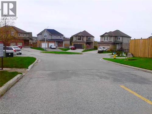 View of asphalt street featuring curbs and a residential view - 212 Westfield Place, Waterloo, ON - Outdoor