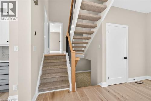 Stairway featuring wood finished floors and baseboards - 4006 Flemish Drive, Burlington, ON - Indoor Photo Showing Other Room