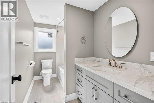 Bathroom with vanity,  shower combination, and light tile patterned flooring - 4006 Flemish Drive, Burlington, ON - Indoor Photo Showing Bathroom