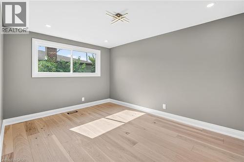 Empty room with light wood-style floors and recessed lighting - 4006 Flemish Drive, Burlington, ON - Indoor Photo Showing Other Room