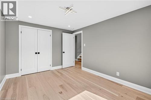 Unfurnished bedroom with light wood-style floors, recessed lighting, and a closet - 4006 Flemish Drive, Burlington, ON - Indoor Photo Showing Other Room