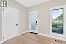 Entryway featuring baseboards and wood finished floors - 4006 Flemish Drive, Burlington, ON  - Indoor Photo Showing Other Room 