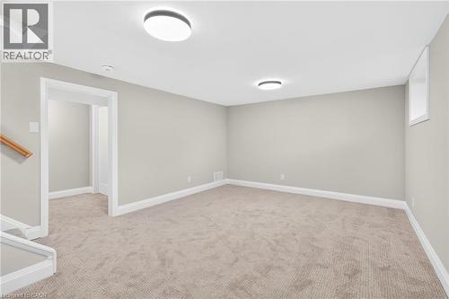 Basement with light carpet and baseboards - 4006 Flemish Drive, Burlington, ON - Indoor Photo Showing Other Room