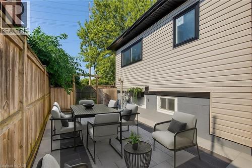 Fenced backyard featuring outdoor dining space and a patio area - 4006 Flemish Drive, Burlington, ON - Outdoor With Deck Patio Veranda With Exterior