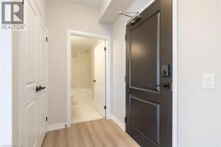Corridor featuring light hardwood / wood-style flooring - 