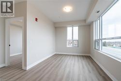 Empty room featuring light wood-type flooring - 