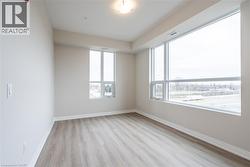 Unfurnished room with a healthy amount of sunlight and light wood-type flooring - 