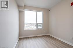 Unfurnished room with light hardwood / wood-style floors - 