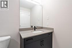 Bathroom with vanity and toilet - 