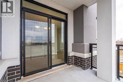 View of exterior entry featuring a balcony - 