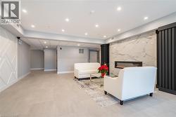 Living room featuring a high end fireplace - 