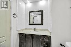 Bathroom featuring vanity and a shower - 