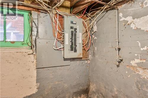 Utility room featuring electric panel - 334 Cannon Street E, Hamilton, ON - Indoor Photo Showing Basement