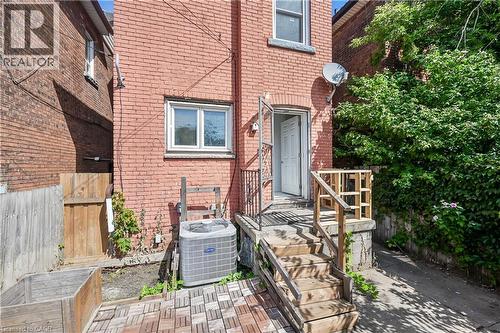 View of exterior entry featuring brick siding - 334 Cannon Street E, Hamilton, ON - Outdoor With Exterior