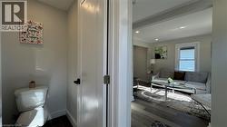 Bathroom with dark wood-style floors and recessed lighting - 