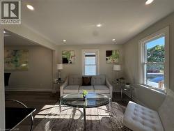 Living room featuring wood finished floors and recessed lighting - 