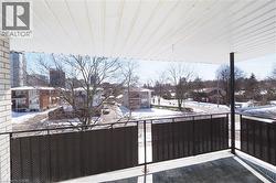 View of snow covered back of property - 