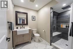 Full bath featuring vanity, a walk in shower, light marble finish flooring, and recessed lighting - 