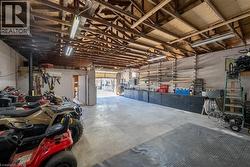 Garage with concrete block wall and a workshop area - 