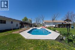 View of pool with a yard and a patio - 