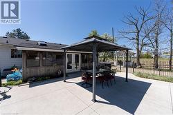 View of patio / terrace with outdoor dining area, a gazebo, and french doors - 