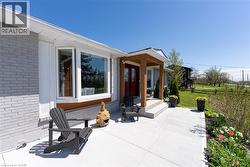 View of patio featuring an outdoor fire pit - 