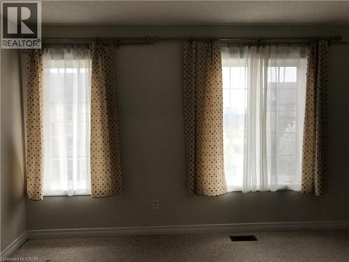Carpeted empty room with a textured ceiling - 4294 Ingram Common, Burlington, ON - Indoor Photo Showing Other Room