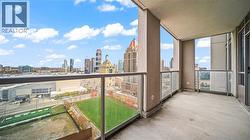 Balcony featuring a skyline view - 