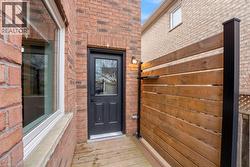 Doorway to property with brick siding - 