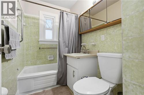 Bathroom with vanity, shower / tub combo, and tile walls - 157 Bridgeport Road E, Waterloo, ON - Indoor Photo Showing Bathroom