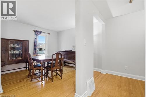 Dining space featuring light wood finished floors and baseboard heating - 157 Bridgeport Road E, Waterloo, ON - Indoor Photo Showing Dining Room
