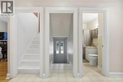 Entryway with light floors and stairs - 