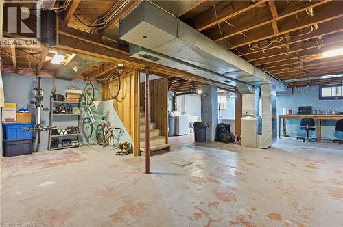 Below grade area with heating unit, independent washer and dryer, and stairs - 157 Bridgeport Road E, Waterloo, ON - Indoor Photo Showing Basement