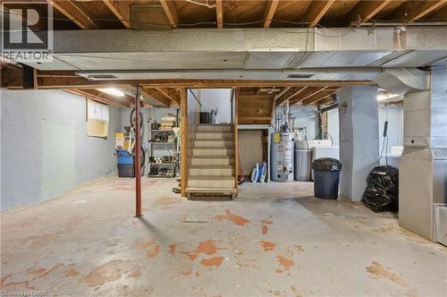 Unfinished basement featuring stairs, heating unit, and gas water heater - 157 Bridgeport Road E, Waterloo, ON - Indoor Photo Showing Basement