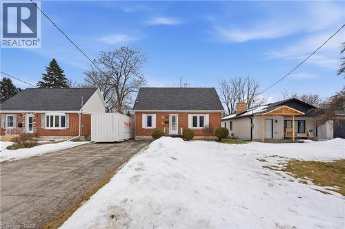 View of front of home with brick siding and roof with shingles - 157 Bridgeport Road E, Waterloo, ON - Outdoor With Facade