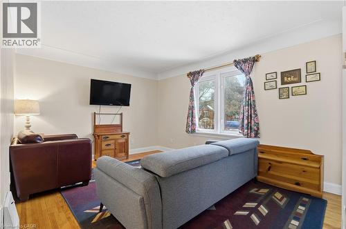 Living area with wood finished floors and baseboard heating - 157 Bridgeport Road E, Waterloo, ON - Indoor Photo Showing Living Room