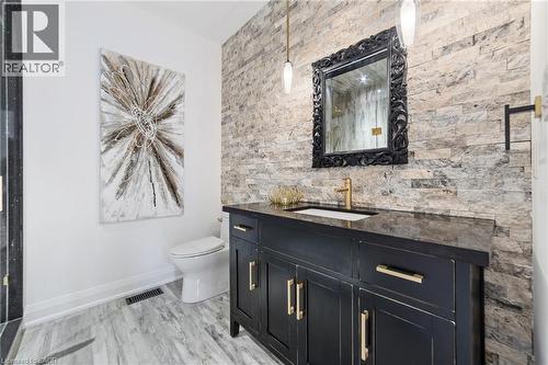 Bathroom featuring walk-in shower with modern tile, rain head, stand alone vanity and toilet - 515 Hamilton Drive, Ancaster, ON - Indoor Photo Showing Bathroom