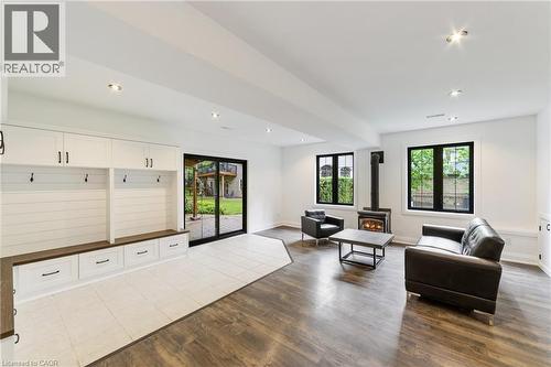 Basement custom white cabinetry for added storage,  gas stove, recessed lighting, laminate flooring, multiple at grade windows, sliding back door backs onto lower patio - 515 Hamilton Drive, Ancaster, ON - Indoor