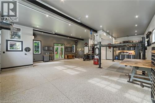 In-floor heating makes this versatile for a workout area as well - 515 Hamilton Drive, Ancaster, ON - Indoor Photo Showing Garage