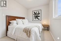 Bedroom featuring carpet floors and baseboards - 