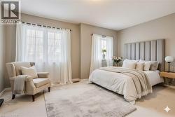 Carpeted bedroom featuring baseboards - 