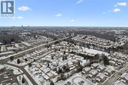 Snowy aerial view featuring a view of city - 