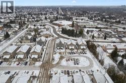 Snowy aerial view featuring a residential view - 