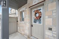 Entrance to property with a gate and stone siding - 