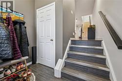 Stairway featuring baseboards and wood finish floors - 