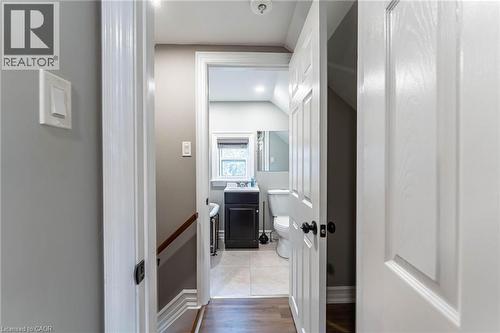 Bathroom with vanity, wood finished floors, and lofted ceiling - 140 Royal Avenue, Hamilton, ON - Indoor Photo Showing Other Room
